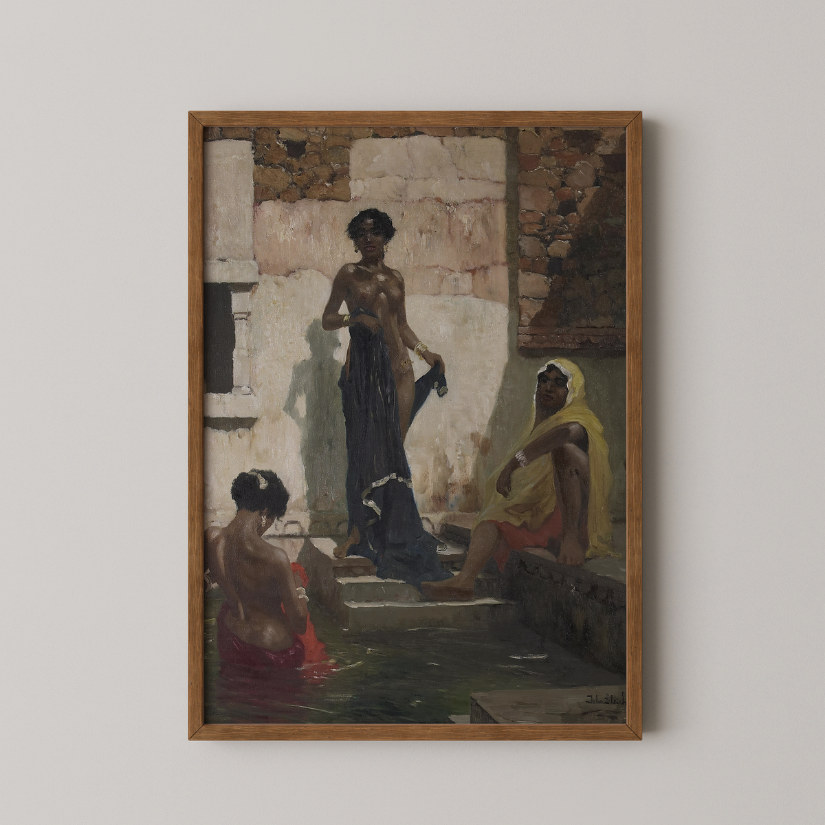 A framed art print featuring a vintage painting of 3  Black women in a bathhouse setting, with a prominent figure in the center and two seated figures in the foreground on a light neutral background