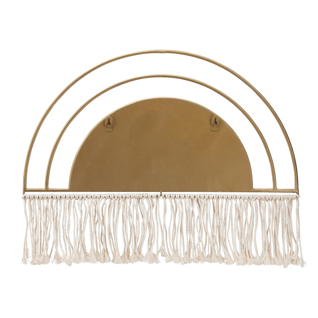 Back of decorative wall mirror with gold frame and fringe on white background